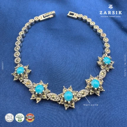 Sky Blue Starlight 925 sterling silver oxidised bracelet with star motifs, marcasite accents and sky blue stones displayed on a clean luxury background