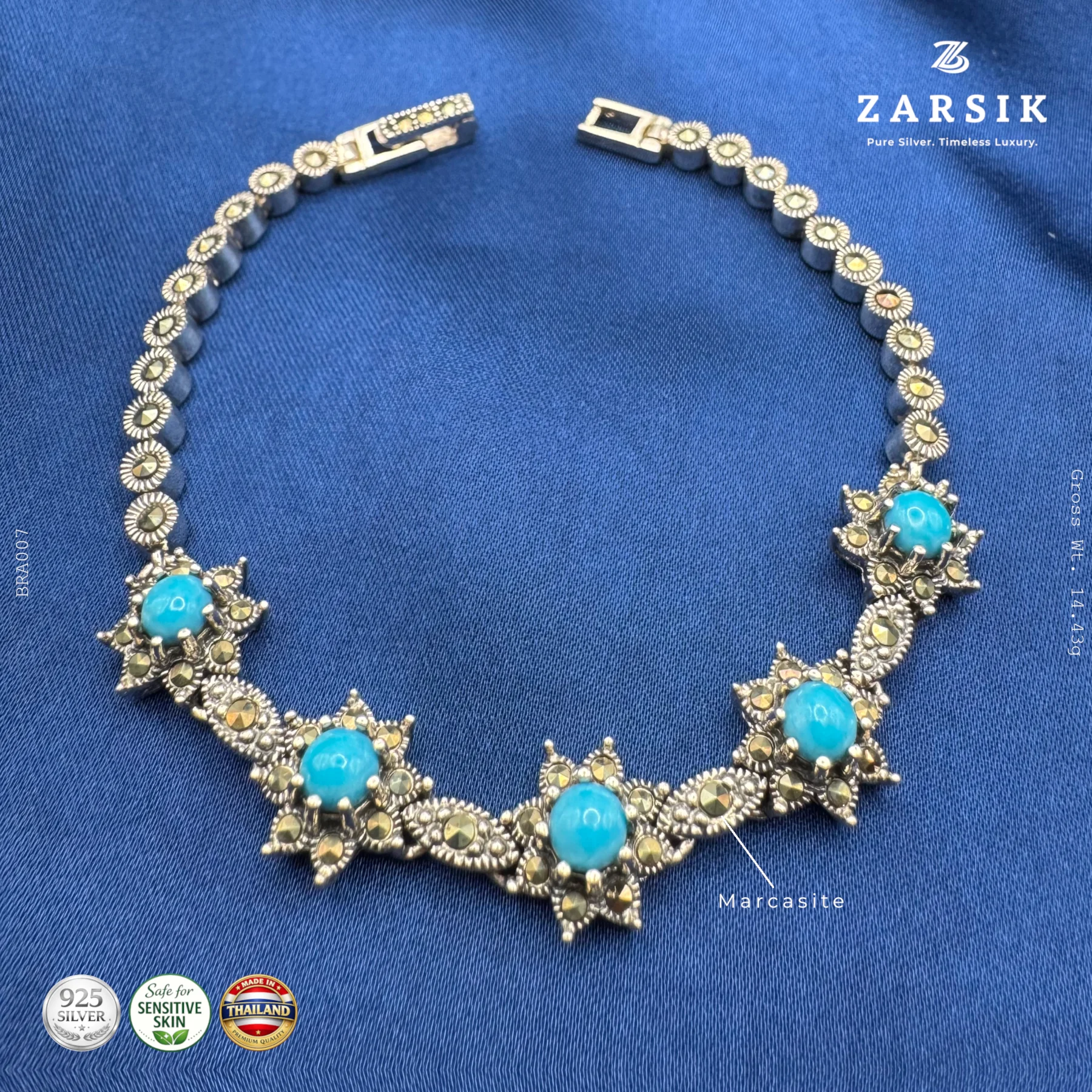 BR007_1 Sky Blue Starlight 925 sterling silver oxidised bracelet with star motifs, marcasite accents and sky blue stones displayed on a clean luxury background