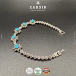 Sky Blue Starlight 925 sterling silver oxidised bracelet with star motifs, marcasite accents and sky blue stones displayed on a clean luxury background