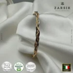 Close-up macro detail of tri-tone 925 sterling silver twist bracelet highlighting twisted rope texture and polished 18K gold, rose gold and rhodium plated finish craftsmanship