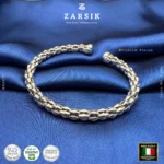 Unisex Italian rhodium plated silver cuff bracelet with hexagonal segments, shown in a high shine hero product shot.