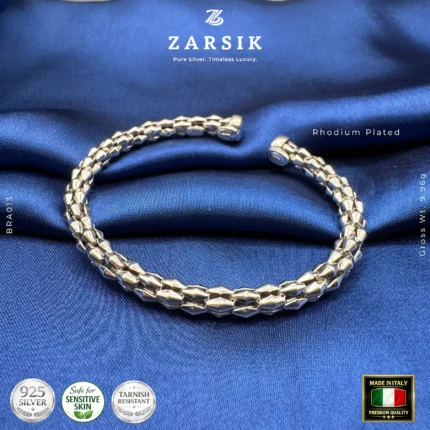 Unisex Italian rhodium plated silver cuff bracelet with hexagonal segments, shown in a high shine hero product shot.