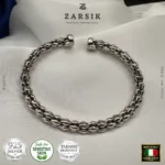 Unisex Italian rhodium plated silver cuff bracelet with hexagonal segments, shown in a high shine hero product shot.