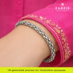 Unisex sterling silver Hexa cuff bracelet worn on the wrist, showing its sculpted geometric shine in a lifestyle setting.