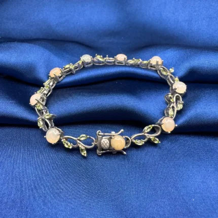 925 Oxidised Silver Opal and Peridot Bracelet with leaf motifs, displayed at full length on a clean white background