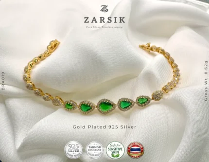 Radiant teardrop glow bracelet in gold plated 925 sterling silver with green stones on white background