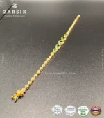 Radiant teardrop glow bracelet in gold plated 925 sterling silver with green stones on white background
