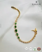 Radiant teardrop glow bracelet in gold plated 925 sterling silver with green stones on white background