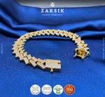 Gold plated 925 sterling silver Cuban link bracelet with cubic zirconia stones weighing 42.35g