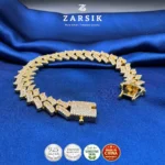 Gold plated 925 sterling silver Cuban link bracelet with cubic zirconia stones weighing 42.35g