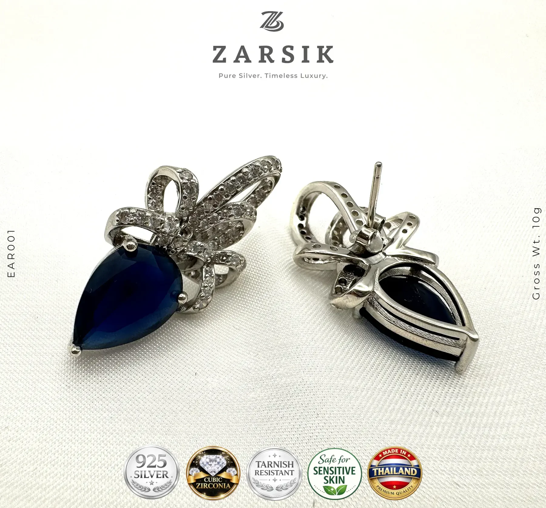 925 sterling silver blue teardrop earrings Elegant 925 sterling silver blue teardrop earrings with cubic zirconia accents and rhodium plating