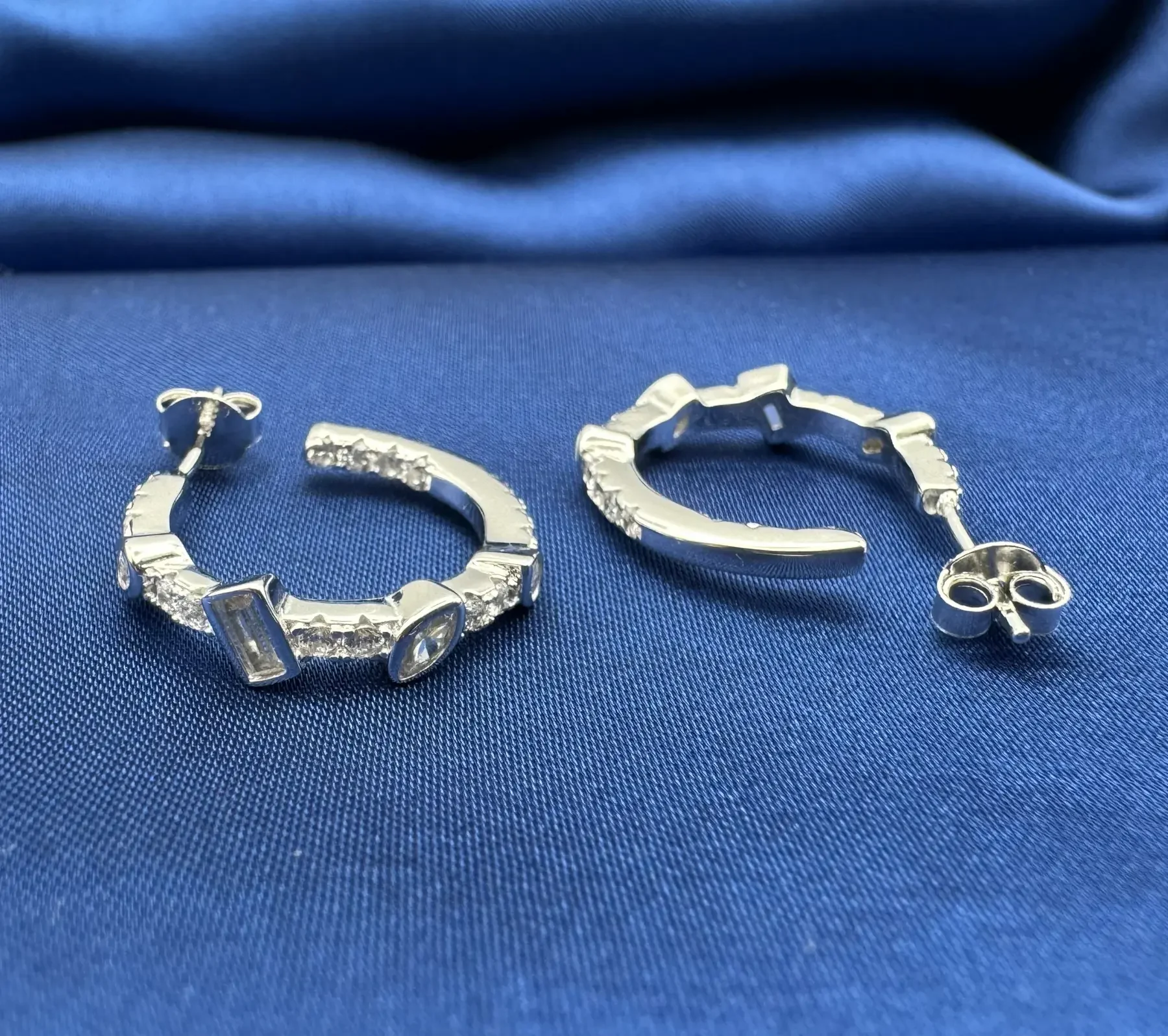 Cascade 925 Silver CZ Hoop Earrings – Rhodium Plated Shine Cascade 925 silver CZ hoop earrings – rhodium-plated hoop earrings with multi-cut cubic zirconia stones