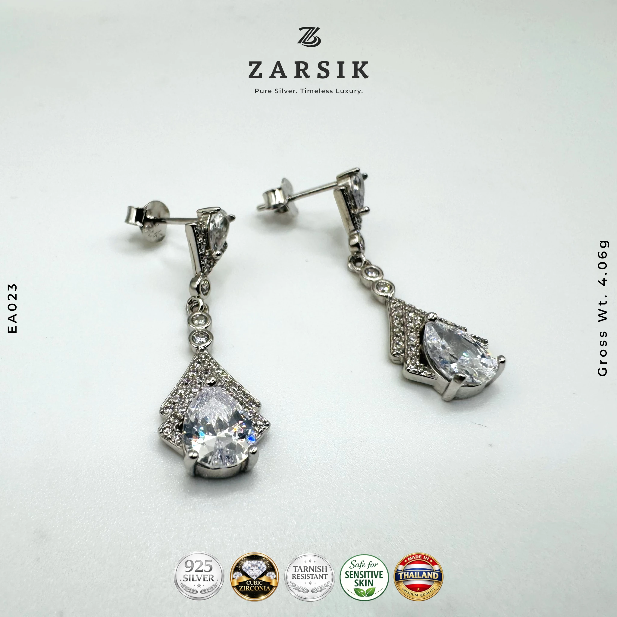 EA023 - Radiant Pear Cascade CZ Drop Earrings in 925 silver with pear and round Cubic Zirconia Radiant Pear Cascade CZ Drop Earrings in 925 silver with pear and round Cubic Zirconia