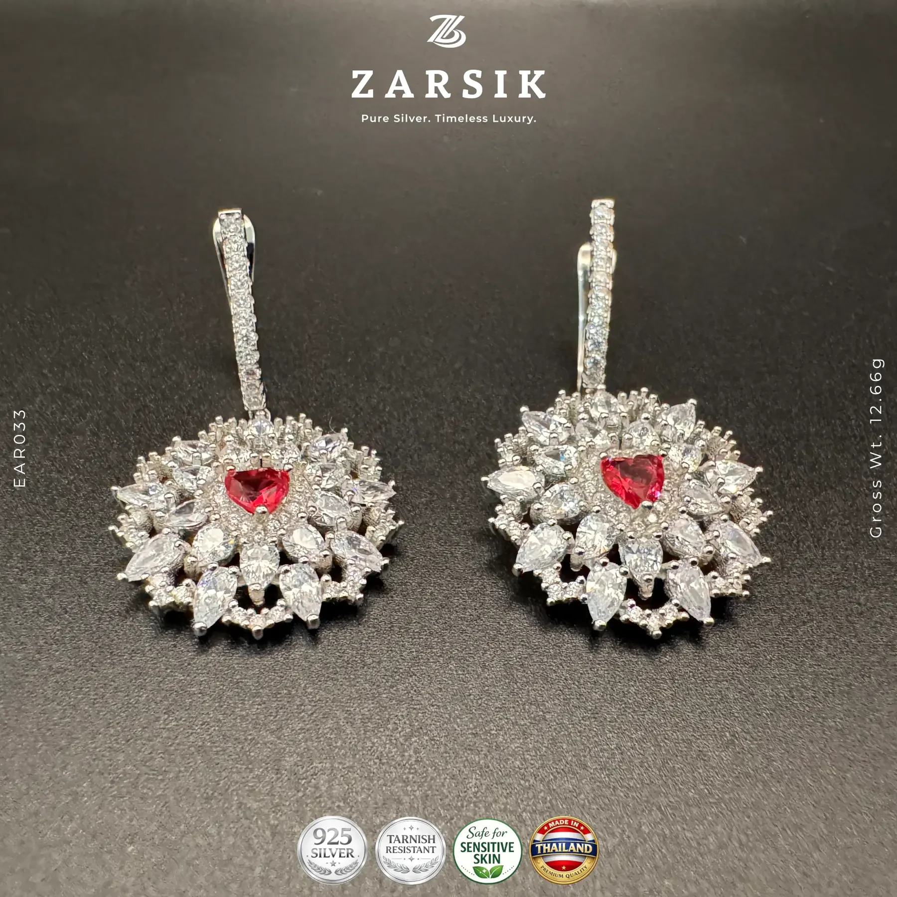 Multi-layer Sparkle 925 Silver Heart Cut Earrings Multi-layer sparkle 925 silver heart cut earrings with synthetic red stone and rhodium plated finish