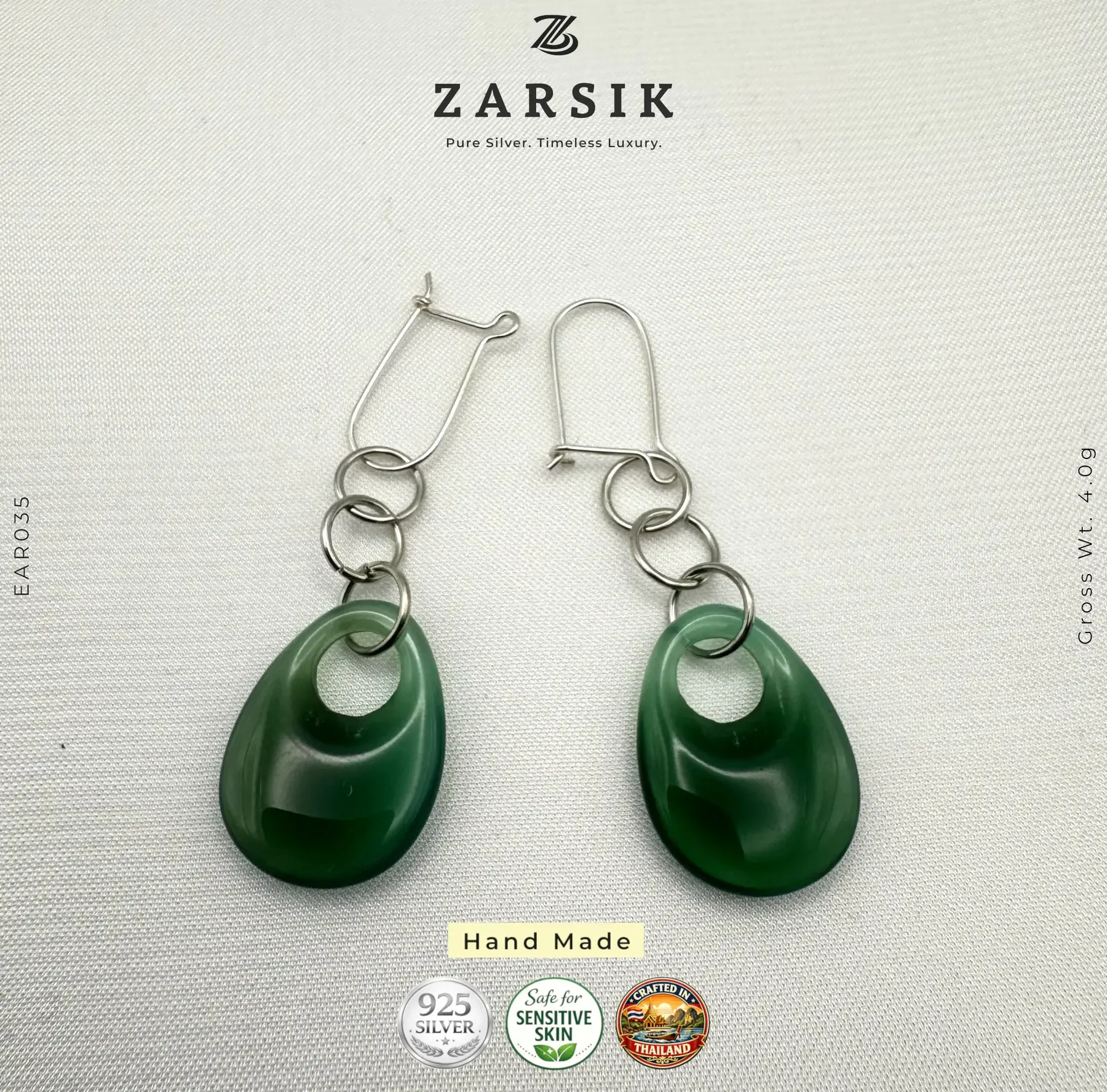 Handmade 925 Silver Green Teardrop Dangle Earrings Pair of handmade 925 silver green teardrop dangle earrings on a luxury soft background.