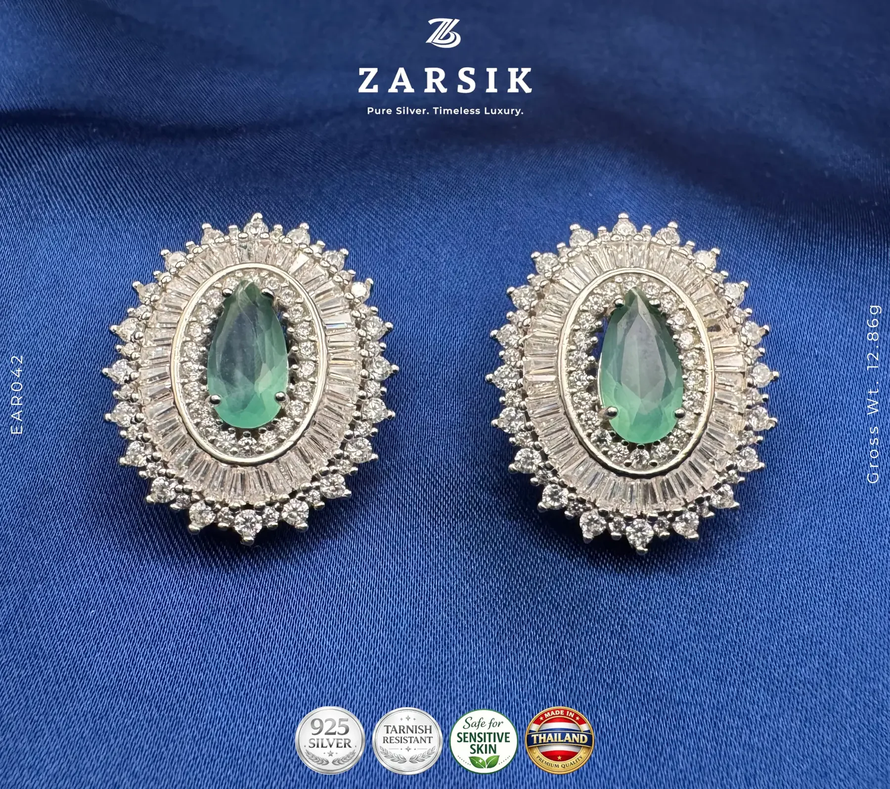 Emerald Glow Halo 925 Silver Earrings | Rhodium Plated Thailand Emerald Glow Halo 925 Silver Earrings – teardrop green stone with clear halo
