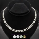 Close-up of flat interlocking curb links and secure lobster clasp on 925 sterling silver rhodium plated chain