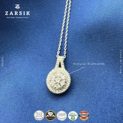 Close up of circular 925 sterling silver pendant showing natural single cut diamonds and rhodium plated finish, made in Thailand