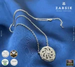 Close-up of 925 silver 360° rotating cubic zirconia pendant showing pavé stones and rhodium-plated circular dial