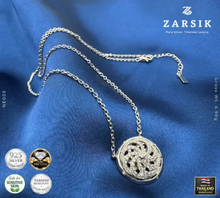 Close-up of 925 silver 360° rotating cubic zirconia pendant showing pavé stones and rhodium-plated circular dial