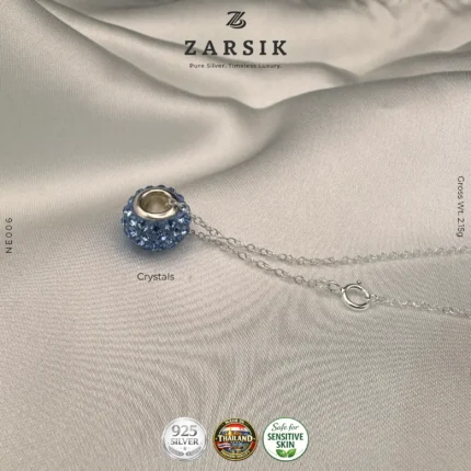 Close-up of tyre-inspired crystal pendant in 925 sterling silver with rhodium inner finish and sparkling crystal detailing