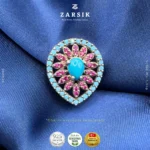 Rhodium plated 925 silver pendant with turquoise centre and rose halo on white background