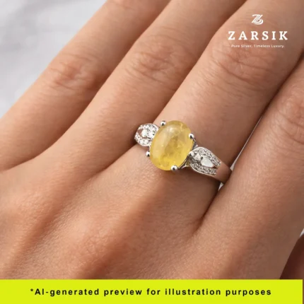 Elegant hand wearing 925 silver moissanite ring with light yellow centre stone in soft natural lighting
