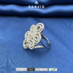 925 sterling silver cubic zirconia statement ring with rhodium plated floral design on white background