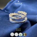 Adjustable 925 silver multi-gemstone serpentine spiral ring in Rhodium-plated finish on plain background