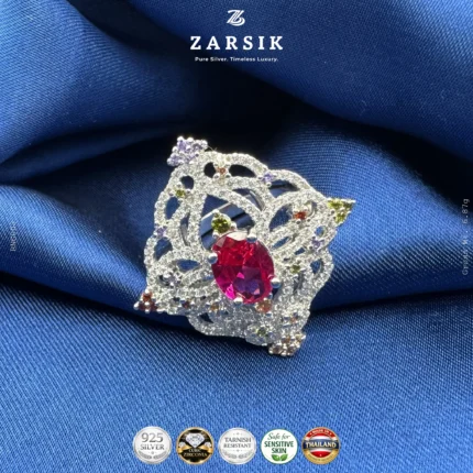925 sterling silver statement ring with coloured centre stone and cubic zirconia halo, rhodium plated jewellery close-up