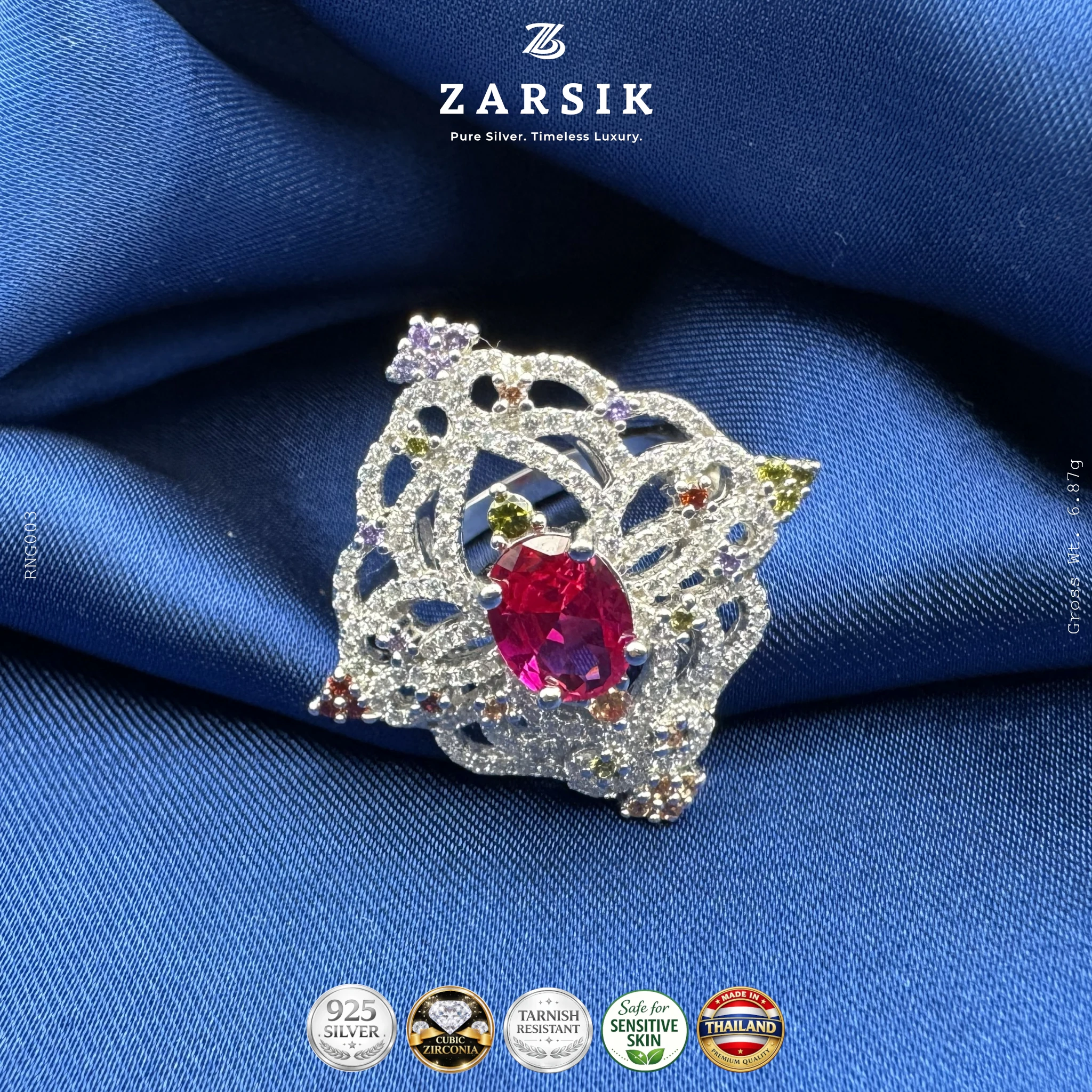 925 sterling silver statement ring with coloured centre stone and cubic zirconia halo, rhodium plated jewellery close-up
