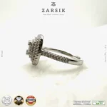 925 sterling silver cubic zirconia statement ring with rhodium plated finish by ZARSIK displayed in elegant lighting