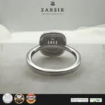 925 sterling silver cubic zirconia statement ring with rhodium plated finish by ZARSIK displayed in elegant lighting
