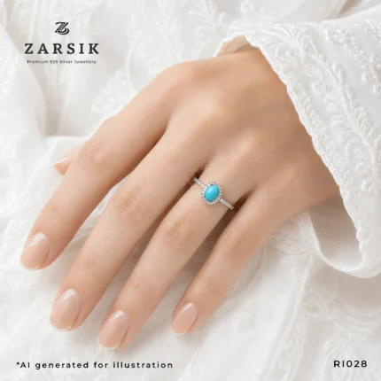 Turquoise 925 Silver Ring on hand with oval blue stone and CZ halo by ZARSIK