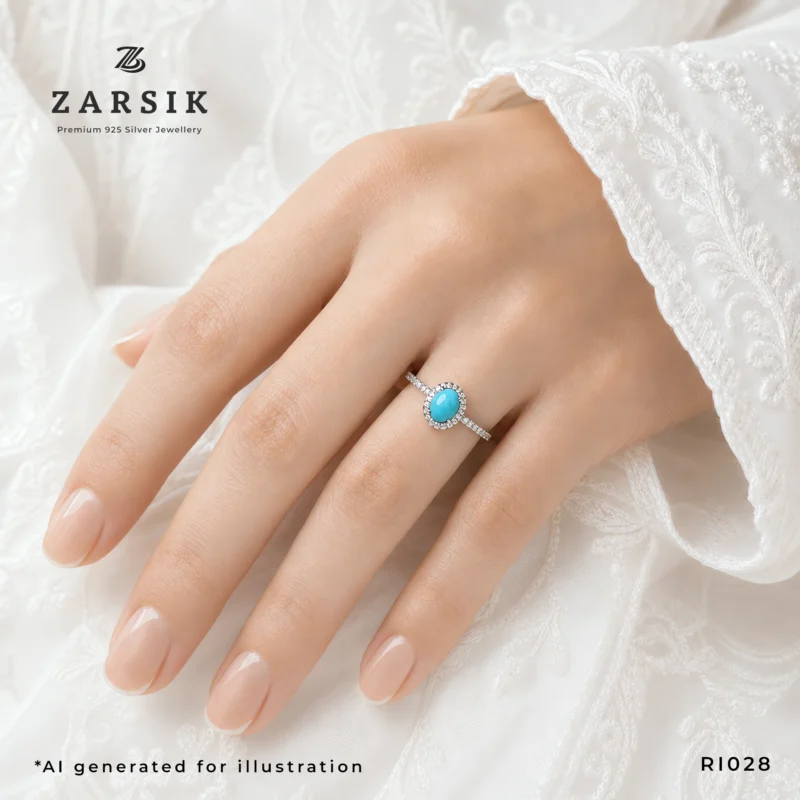 Turquoise 925 Silver Ring on hand with oval blue stone and CZ halo by ZARSIK