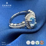 Blue Topaz 925 Silver Ring with cubic zirconia halo and rhodium-plated sterling silver band