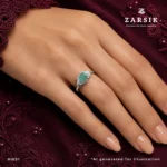 Emerald 925 Silver Ring on hand with oval emerald and cubic zirconia accents by ZARSIK