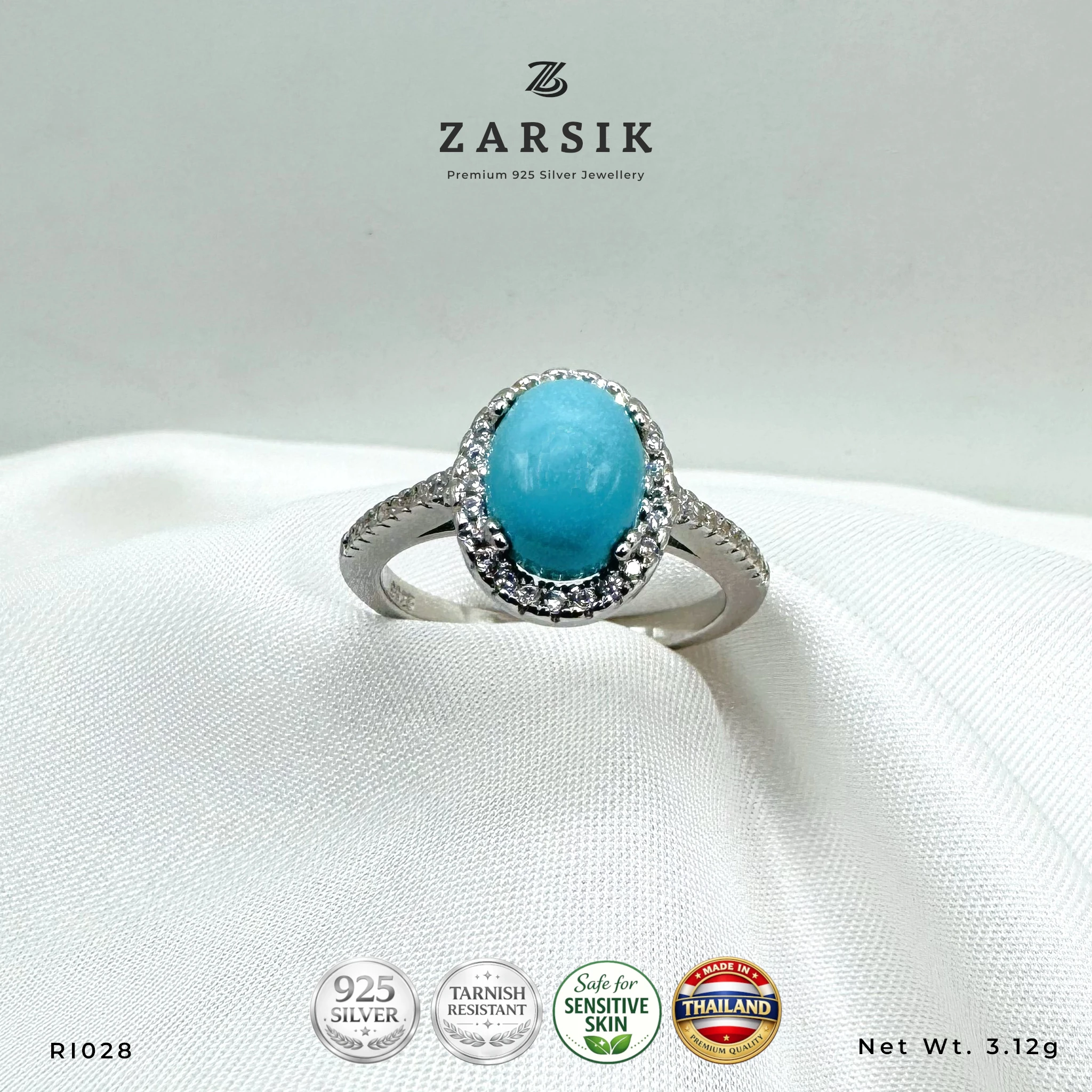 RI028_1 Turquoise 925 Silver Ring RI028 with oval blue centre stone, CZ halo and rhodium-plated sterling silver band by ZARSIK