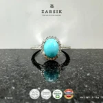 Turquoise 925 Silver Ring RI028 with oval blue centre stone, CZ halo and rhodium-plated sterling silver band by ZARSIK