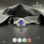 Elegant oval sapphire halo ring crafted in 925 sterling silver with sparkling cubic zirconia accents