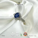 Elegant oval sapphire halo ring crafted in 925 sterling silver with sparkling cubic zirconia accents