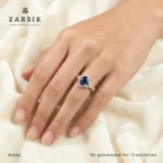 Woman wearing an elegant oval sapphire halo ring in 925 sterling silver with cubic zirconia detailing