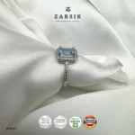 Radiant Blue Topaz Halo Ring crafted in 925 sterling silver with emerald-cut blue topaz and cubic zirconia halo