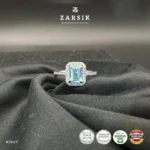 Radiant Blue Topaz Halo Ring crafted in 925 sterling silver with emerald-cut blue topaz and cubic zirconia halo