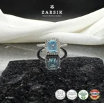 Radiant Blue Topaz Halo Ring crafted in 925 sterling silver with emerald-cut blue topaz and cubic zirconia halo