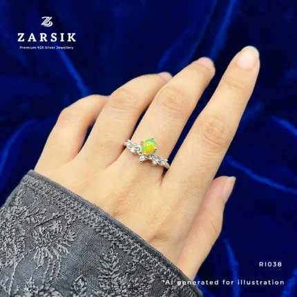 Woman wearing an elegant opal floral ring in 925 sterling silver with natural oval opal and cubic zirconia detailing