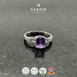 Majestic Purple Amethyst 925 Silver solitaire ring featuring an oval-cut natural amethyst, sparkling cubic zirconia split shoulders and premium rhodium plating.
