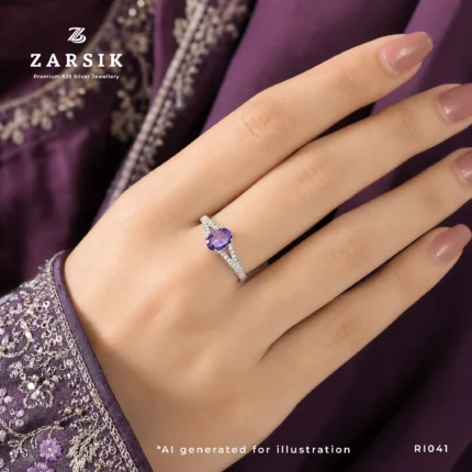 Elegant woman wearing a Majestic Purple Amethyst 925 Silver solitaire ring with an oval-cut amethyst and sparkling cubic zirconia, styled for everyday luxury and special occasions.