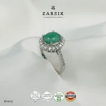 925 Silver Emerald Ring featuring a natural oval-cut emerald, sparkling cubic zirconia halo, rhodium plating and elegant shoulder detailing.