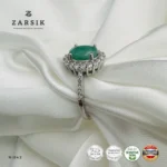 Emerald Ring crafted from authentic 925 Silver featuring a natural oval-cut emerald, sparkling cubic zirconia halo, rhodium plating and elegant shoulder detailing.